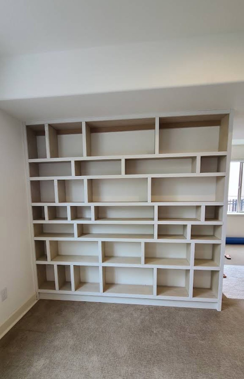 Finished floor-to-ceiling built-in bookcase